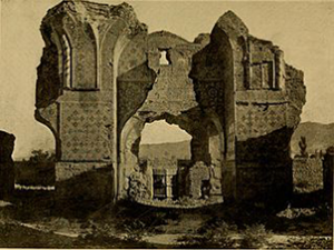 Sepia-toned photograph of a looming ruin